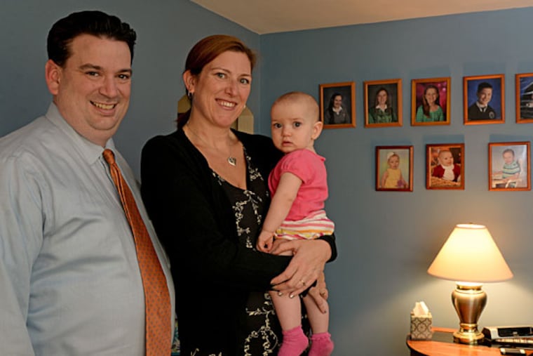 Jim and Kate Meredith with daughter Danielle. Earlier, they had lost a pregnancy. By sharing their loss, they learned they were part of a community of grief. ( TOM GRALISH / Staff Photographer )