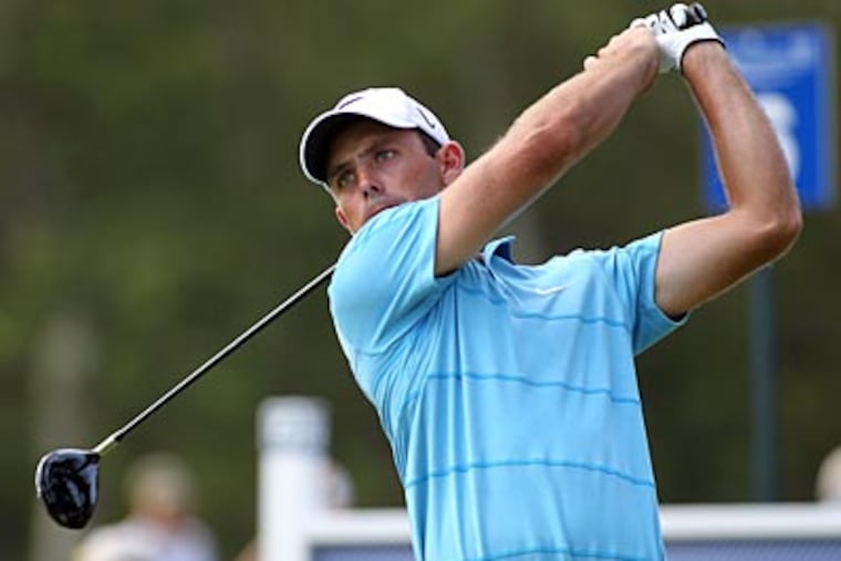 Charl Schwartzel tees off on the sixth hole during the second round of the Deutsche Bank Championship. (Stew Milne/AP)