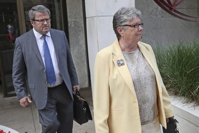 Former Pa. Treasurer Barbara Hafer (right) and her attorney, John Knorr, walk out of the federal courthouse in Harrisburg.