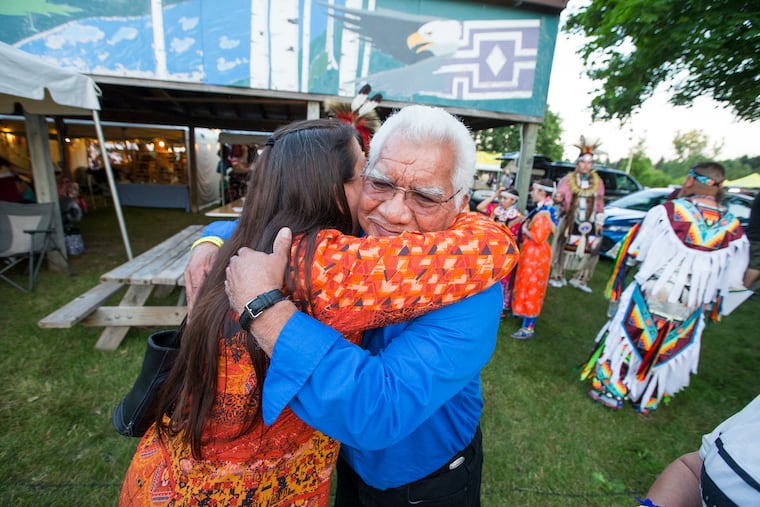 The homecoming of Jemima Metoxen, Sophia Coulon, and Ophelia Powless to Oneida, Wisconsin coincided with the 47th annual Oneida Pow-wow. The sound of the drums echoed over the rolling hillsides filling the landscape like a reawakened heartbeat. Over 25 descendants of the three girls were recognized with an honor song near the start of the pow-wow. Violet Blake, left, and Hank Huff, the great-niece and nephew of Jemima Metoxen hug after the honor song on June 28, 2019.