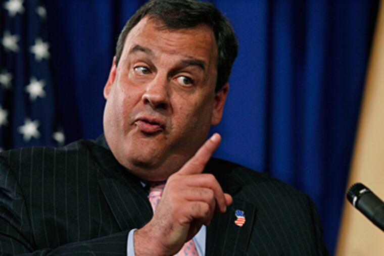 "The whole system is not working as it was intended to work," Gov. Christie said of the greenhouse-gas initiative in his announcement with Bob Martin, N.J. commissioner of Environmental Protection. Environmentalists disagreed with the move and said it would cost state jobs. (Mel Evans / Associated Press)