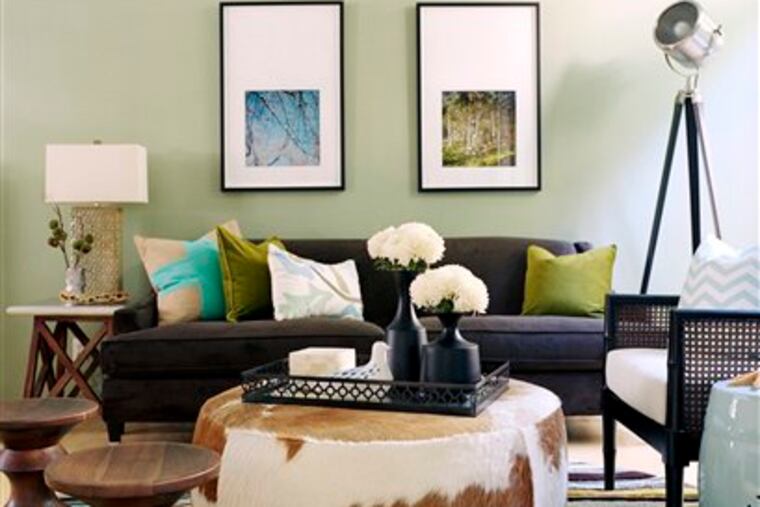 Sofa or sectional? Try a hybrid with a sofa, ottoman and side stools. (AP Photo/Kyle Schuneman, Joe Schmelzer)