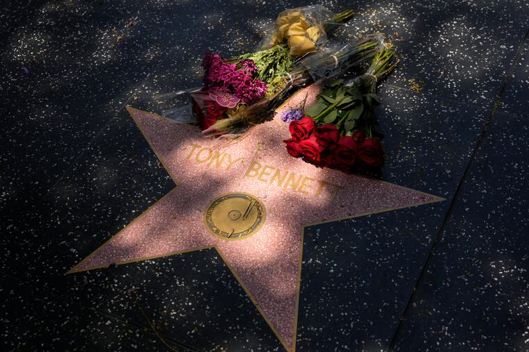 Flowers lay atop the Hollywood Walk of Fame star of the late singer Tony Bennett hours after his death Friday.