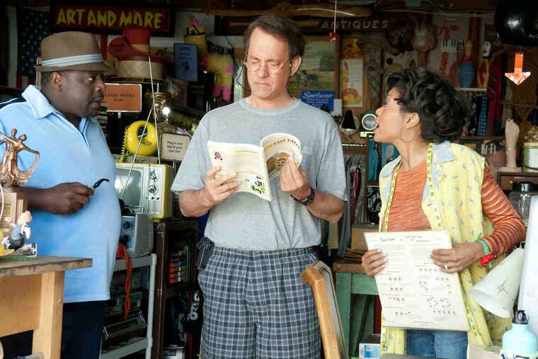 From left: Cedric the Entertainer, Tom Hanks and Taraji P. Henson shop for bargains.