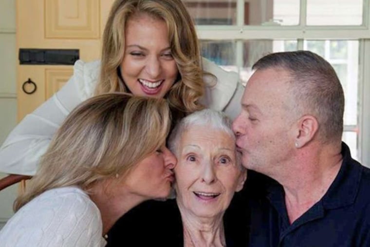 Mary Scottoline surrounded by (from left) daughter Lisa, granddaughter Francesca Serritella, and son Frank.