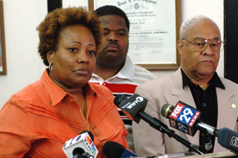 Guardian Civic League president Rochelle Bilal (left) addresses the media on Monday. Threats targeting Bilal have been posted on domelights.com. (James Heaney / Staff Photographer)