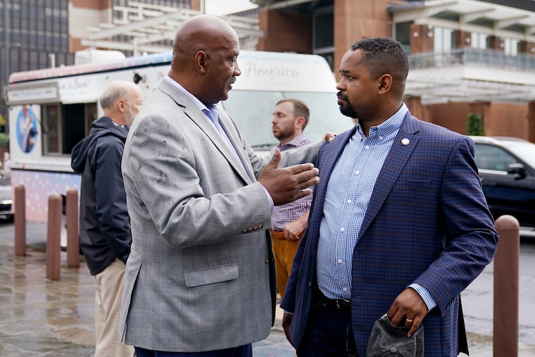 U.S. Rep. Dwight Evans (D., Philadelphia) (left) talks with state Sen. Sharif Street (D., Philadelphia) before a news conference at Independence Mall in Philadelphia in 2021.