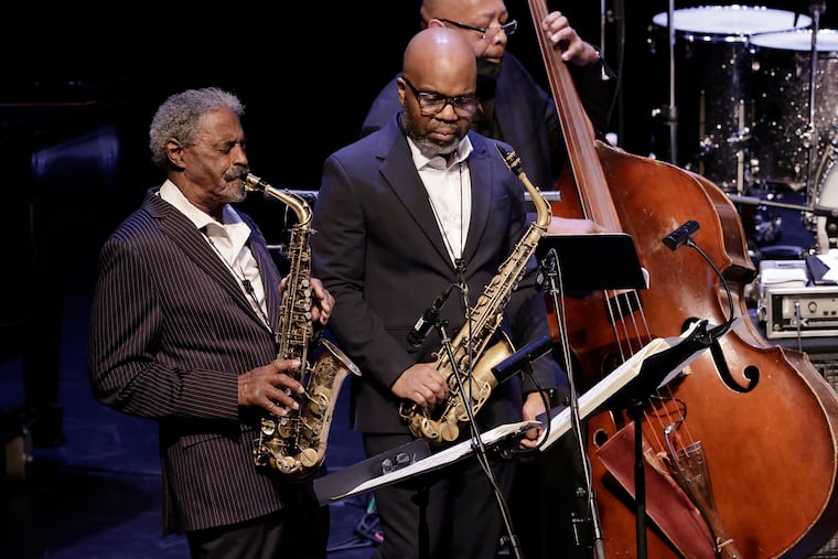 (L-R) Guest artist saxophonist Charles McPherson has a solo, guest artist saxophonist Jaleel Shaw looks on and bass player Lee Smith plays along during the Charlie Parker 100th birthday tribute as The Jazz Orchestra of Philadelphia returned to the stage with its annual holiday tradition—The Jazz Orchestra of Philadelphia Harlem Nutcracker at Univ. of Penn’s Zellerbach Theatre in Phila., Pa. on Dec. 18, 2021.