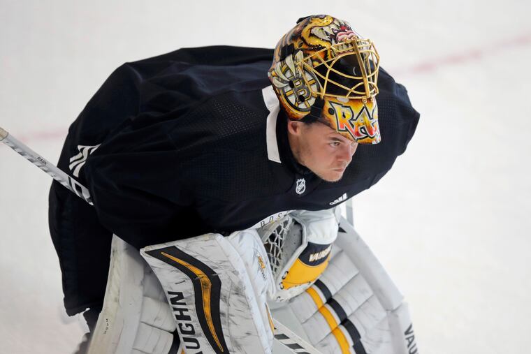Boston Bruins goaltender Tuukka Rask skates away from the crease with his mask up at the NHL hockey team's camp on Tuesday, July 14, 2020, in Boston. (AP Photo/Charles Krupa)
