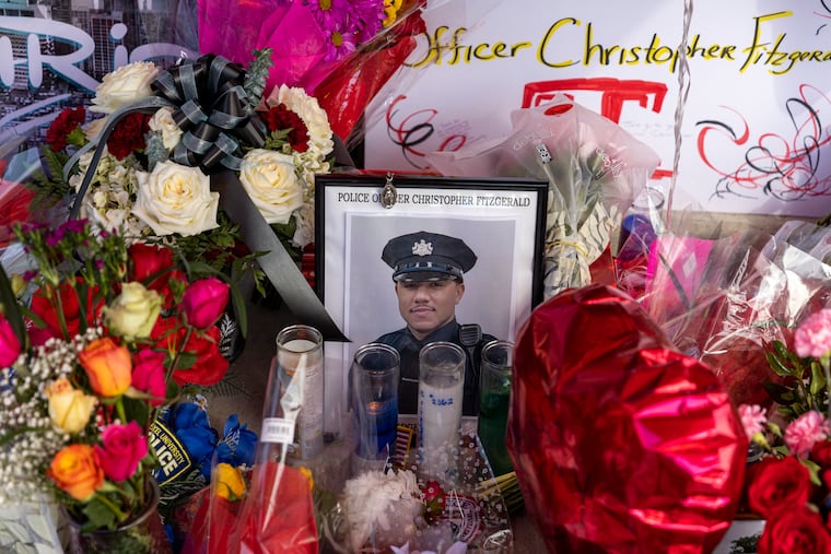 A memorial for Temple University Police Officer Christopher Fitzgerald at the corner of 17th and Bouvier Streets, near the place he was killed in 2023.