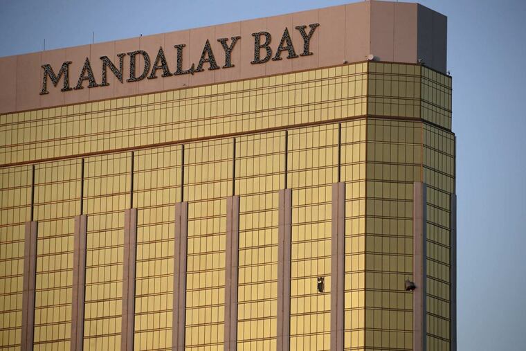 Drapes billow out of broken windows at the Mandalay Bay resort and casino Monday, Oct. 2, 2017, on the Las Vegas Strip following a deadly shooting at a music festival in Las Vegas. A gunman was found dead inside a hotel room.