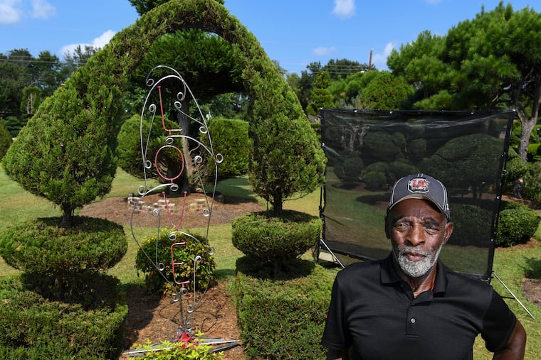 Pearl Fryar in his topiary garden in Bishopville, S.C.