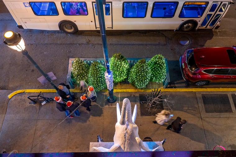 December 11, 2023: Seen from above, a large, pale pachyderm appears over the new holiday pop-up bar White Elephant.