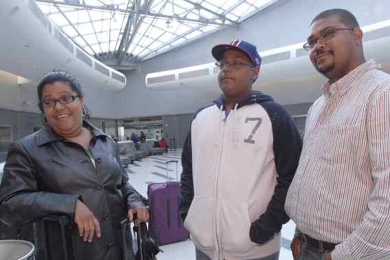 Maria Altagracia of Allentown was returning home from the Dominican Republic with her son Alexander Nathaniel and husband, Cesar Nathaniel. "We noticed a lot of security," she said.