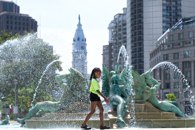 Makayla White, 10, cools off at the Swann Memorial Fountains in 2024.