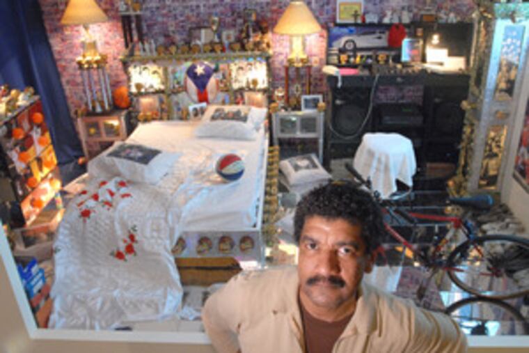 Osorio in front of another facet of his multimedia installation at the Lighthouse.