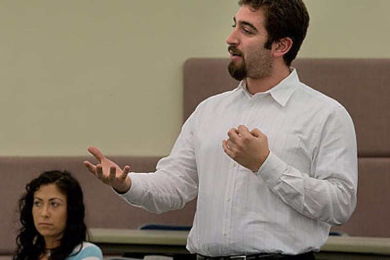 First-year law student David Hasner, of Mount Laurel, asks a question of the state Supreme Court justices. (David M Warren/Staff Photographer)