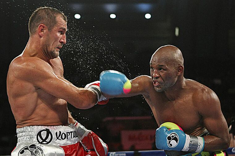 Bernard Hopkins punches Sergey Kovalev. (Tim Larsen/AP)