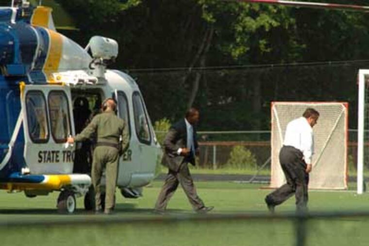 In a May 31, 2011 photo, New Jersey Gov. Chris Christie (right) arrives in Montvale, N.J., via state police helicopter where he later watched his son play in the the St. Joseph vs. Delbarton baseball game Tuesday afternoon, in Montvale, N.J. (Christopher Costa / <A HREF="http://ridgewood.patch.com/">Ridgewood.Patch.com</a> )
