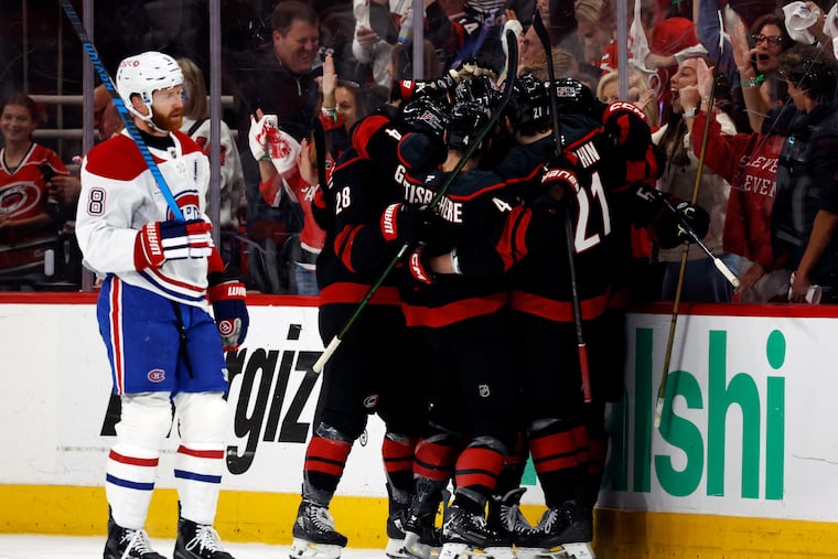 Carolina Hurricanes players celebrate after a goal by Bellmawr’s Eric Robinson during their Game 5 win to send them to the Stanley Cup final.
