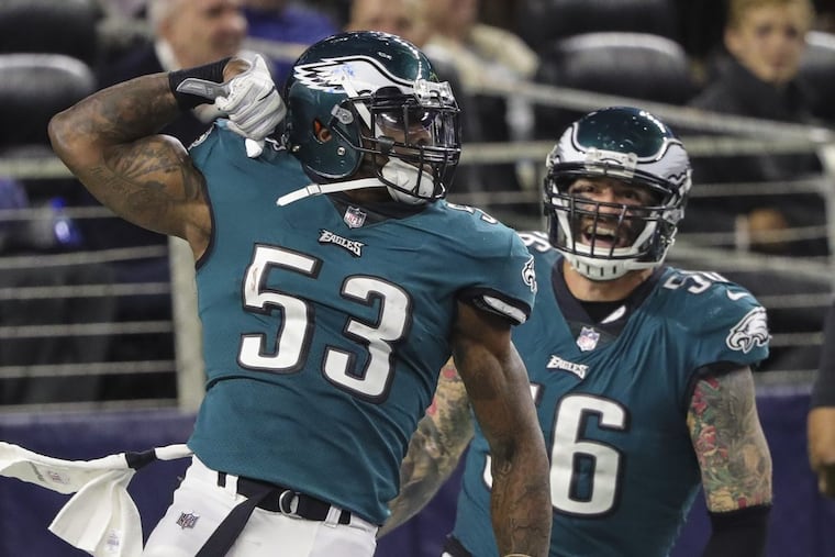 Eagles linebacker Nigel Bradham (53), here celebrating a fumble return for a touchdown against Dallas in November, is one of the keys to stopping the Falcons’ rushing game.