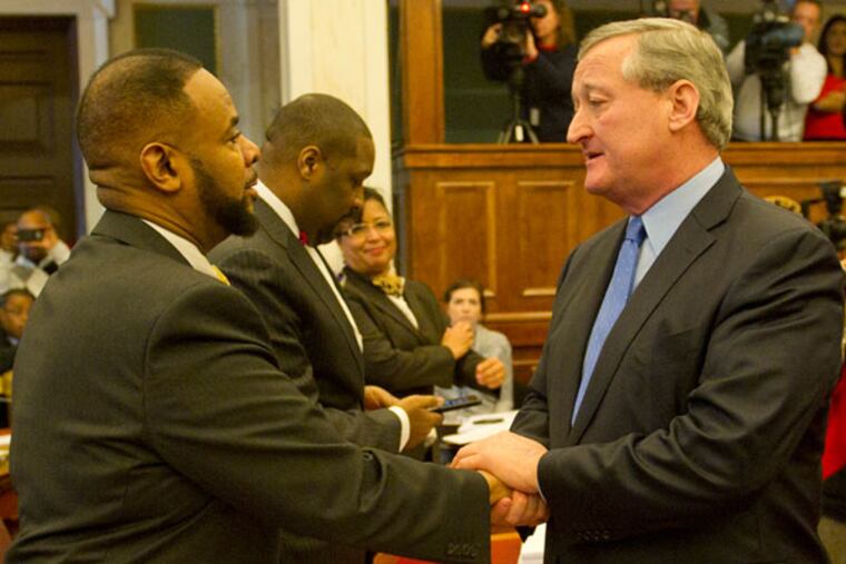 Mayor Kenney shakes hands with City Council members including Curtis Jones, left, after presenting his first budget address.