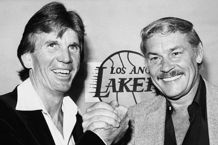 Los Angeles Lakers coach Paul Westhead (left) shakes hands with Lakers' owner Jerry Buss, April 1980.