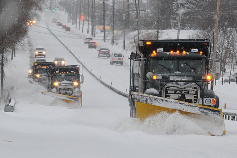 File photo: A PennDot plow train headed south on Route 202 in Birmingham Township Feb. 13, 2014 as the Philadelphia region got slammed with a Nor'easter snowstorm. ( CLEM MURRAY / Staff Photographer )