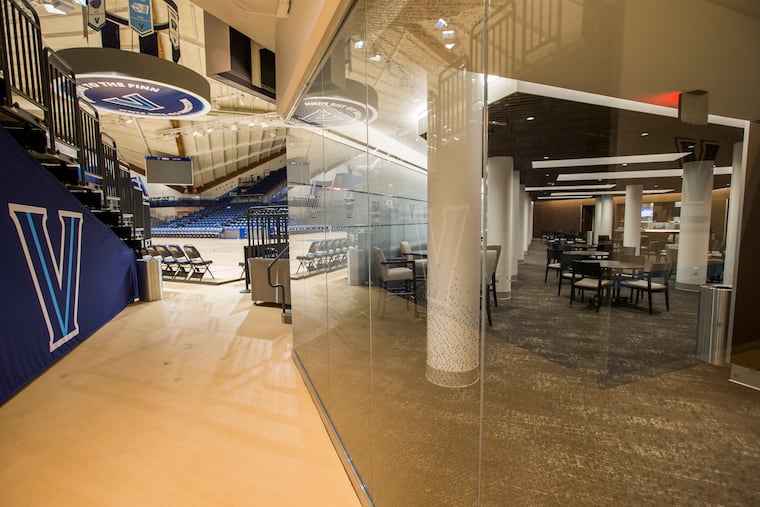 The Davis Courtside Club, right, just off the court at Finneran Pavilion, is reserved for major donors.