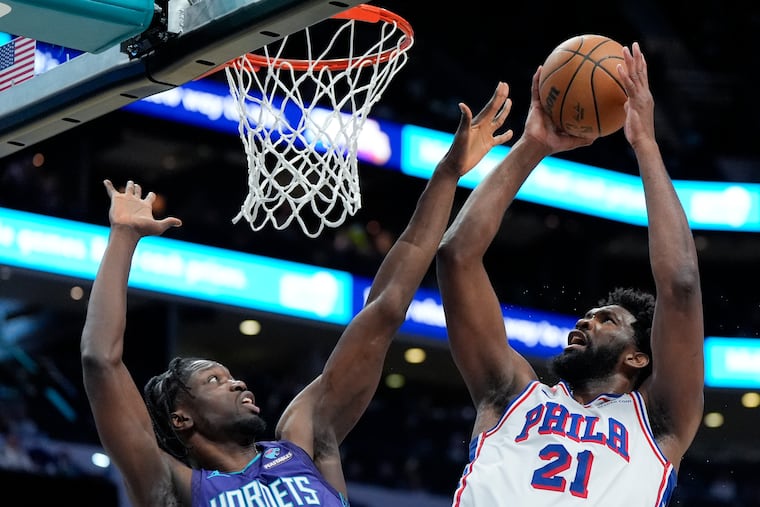 Joel Embiid shoots over Charlotte Hornets center Nathan Mensah during the second half on Jan. 20.