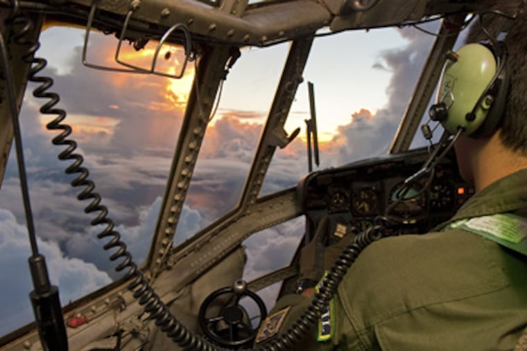 A pilot searches the Atlantic for the black box of audio recordings and flight data after Flight 447 was lost. (AP Photo/Johnson Barros, Brazilian Air Force)