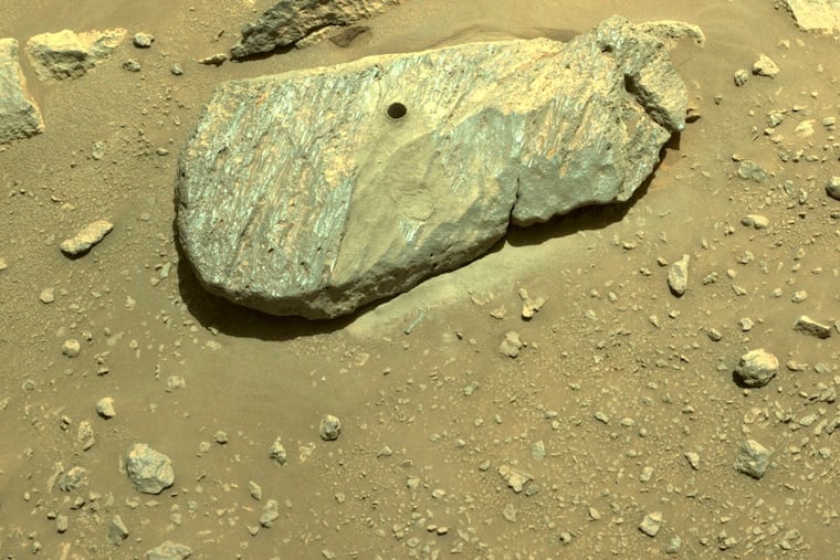 This Sept. 1, 2021 image provided by NASA shows the hole drilled by the Perseverance rover during its second sample-collection attempt in Mars' Jezero Crater. (NASA/JPL-Caltech via AP)