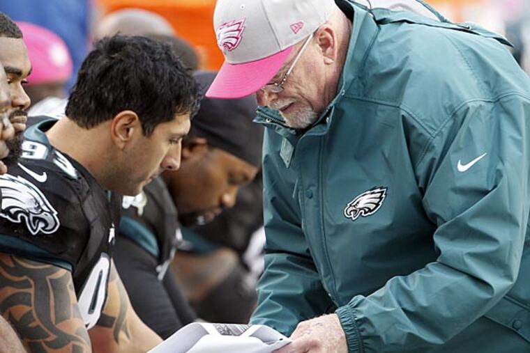 Former Eagles defensive end Jason Babin (left) and defensive line coach Jim Washburn (right). (Yong Kim/Staff file photo)