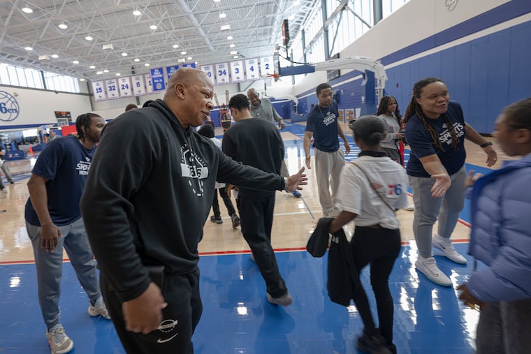 Former Sixers Marc Jackson and World B. Free mentored students from KIPP Academy during a 'Sports With Us' basketball camp.