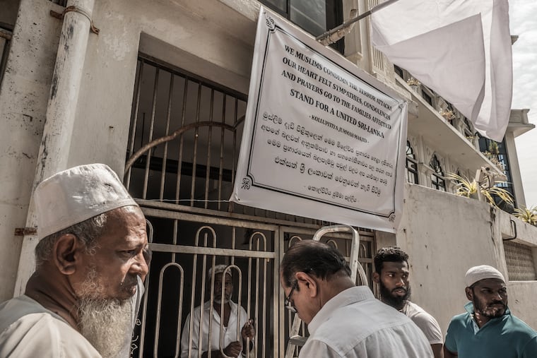 Muslims at the Kollupitiya Jumma Masjid in Colombo, Sri Lanka, install a banner offering sympathies, condolences and prayers to the families affected in the Easter Sunday attacks.