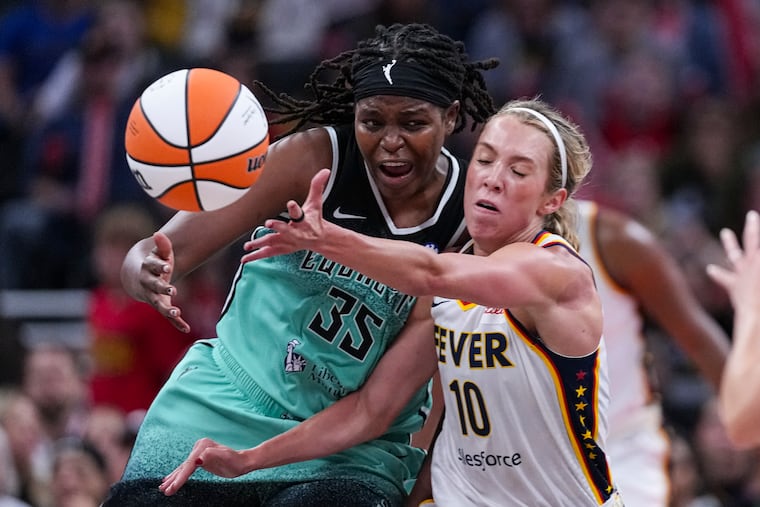 New York Liberty center Jonquel Jones (35) and Indiana Fever guard Lexie Hull (10) go for a loose ball in the second half on Saturday in Indianapolis.