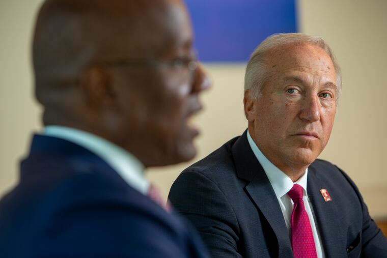 Mitchell Morgan, chair of Temple's board of trustees, (right) with Jason Wingard, president of Temple University, on the day his hiring was announced.