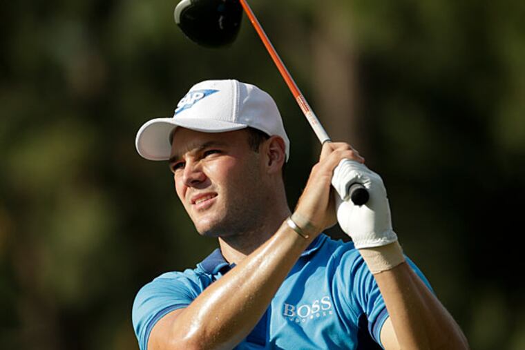 Martin Kaymer, of Germany, watches his tee shot on the 18th hole during the first round of the U.S. Open golf tournament in Pinehurst, N.C., Thursday, June 12, 2014. (Charlie Riedel/AP)