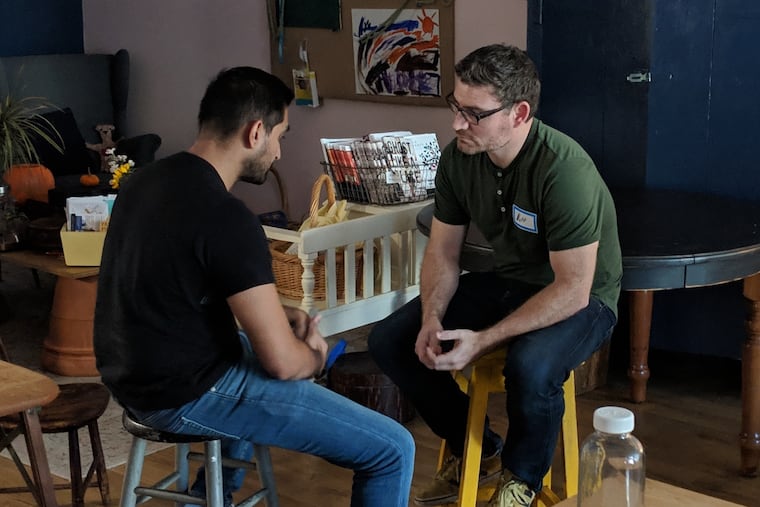 Two men at a recent authentic relating session at the Common Space in Ardmore.