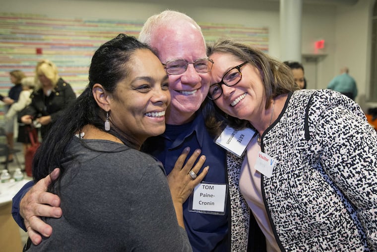 Following the event, L-R: Jennifer Morales-Torres, Tom Paine-Cronin, and Kate Williamson hug. They had been part of a discussion group during the evening. About two dozens voters will gathered with host Ronnie Polaneczky to discuss how we can heal as a country from the divisive presidential-election campaigns and their hope and dreams, for themselves, their families, and the country. CHARLES FOX / Staff Photographer