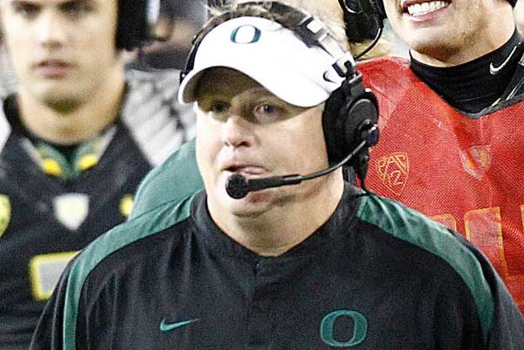 Chip Kelly is considered one of the leading candidates for the Eagles job, but stiff competition is expected from other teams with vacancies. (Don Ryan/AP)