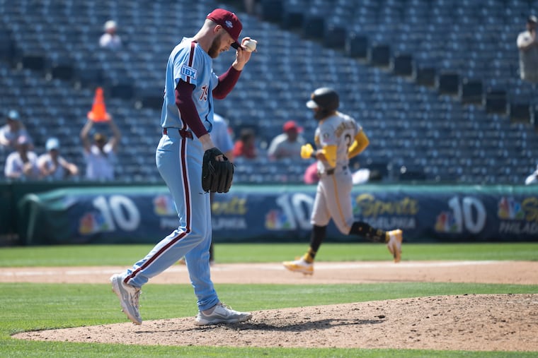 Phillies pitcher Kyle Backhus heads back to the mound after allowing a solo home run to the Pirates' Nick Gonzales during the ninth inning on Thursday.