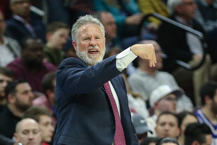 Sixers' head coach Brett Brown calls plays against the Raptors during the 1st quarter at the Wells Fargo Center in Philadelphia, Tuesday, February 5, 2019. STEVEN M. FALK / Staff Photographer