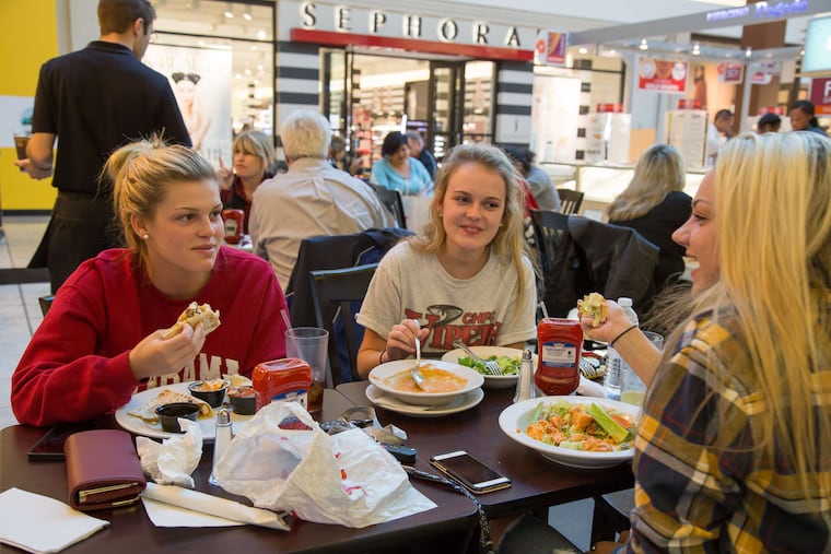 Friends eating a meal at the Bistro at Cherry Hill.