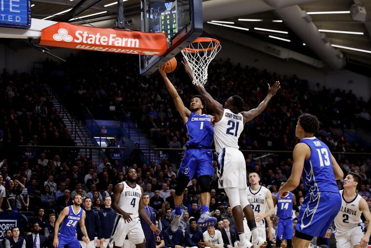 Creighton's Davion Mintz (1) goes up for a shot against Villanova's Dhamir Cosby-Roundtree (21) during the first half of an NCAA college basketball game Wednesday, Feb. 6, 2019, in Villanova, Pa. (AP Photo/Matt Slocum)