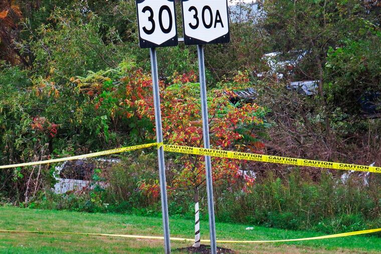 FILE - In this Oct. 6, 2018, file photo, a limousine (left) has landed in the woods following a fatal crash in Schoharie, N.Y. The National Transportation Safety Board said on Thursday, Jan. 10, 2019, that some federal employees furloughed under the government shutdown may be recalled to start examining the limousine that crashed in rural upstate New York, killing 20 people.