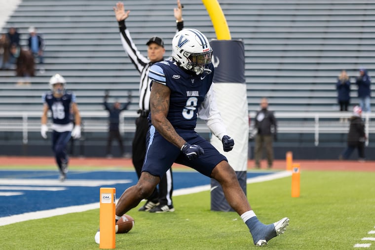 Villanova tight end Antonio Johnson celebrates after scoring a touchdown in overtime against Stony Brook on Saturday.