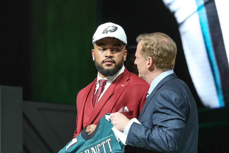 Commissioner Roger Goodell talks with Eagle defensive end Derek Barnett during the NFL draft on the Art Museum steps.