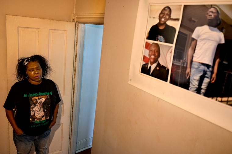 Tysha Melton visits a memorial to her dead son, Travys Taylor, in his old room in her home. In March, she said, a dozen law enforcement officers raided her home, looking to arrest Taylor on a bench warrant for criminal trespass. He had been killed five months earlier.