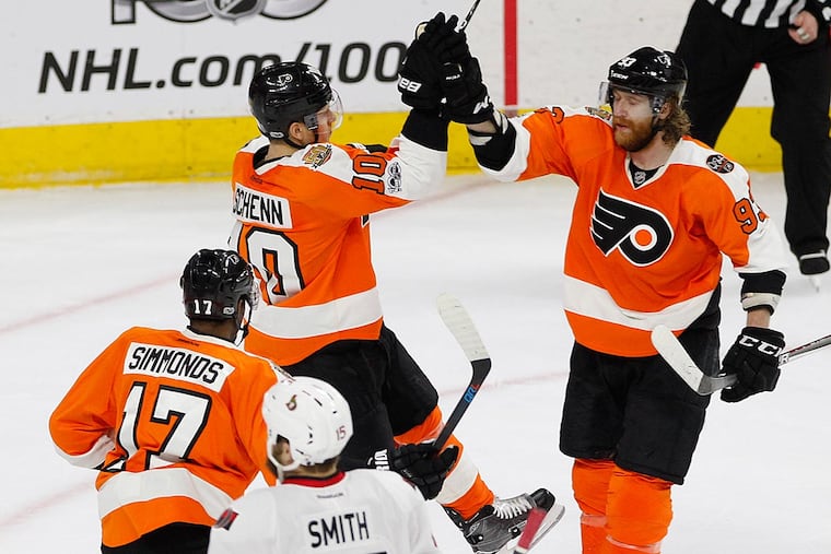 Brayden Schenn (center) is contragulated by Jakub Voracek after a goal.